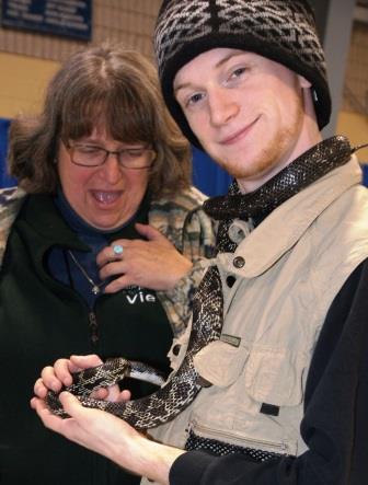 Getting close to a snake held by Ross Blackwood